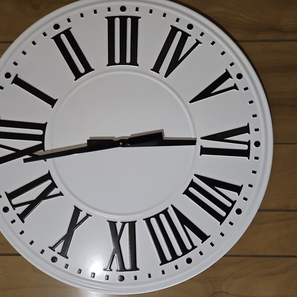 White and Black Roman Numeral Wall Clock